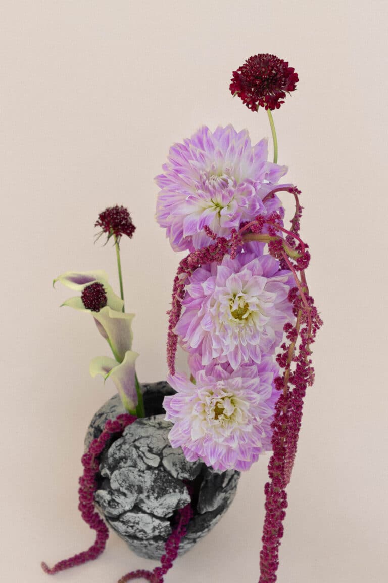 Floral arrangement with pink dahlias, scabiosa, and calla lily
